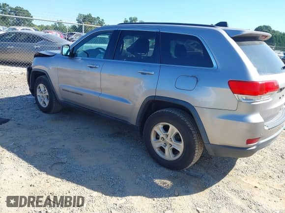 2017 Jeep Grand Cherokee Laredo with VIN 1C4RJEAGXHC671814, listed as a IAAI auction lot 43097972 with 165,240 mi miles and . Bid and sale history available at DreamBid. Image 3.
