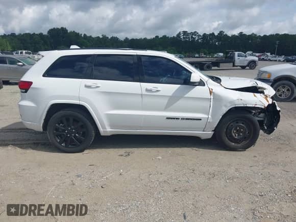 2019 Jeep Grand Cherokee Altitude with VIN 1C4RJEAG3KC597689, listed as a IAAI auction lot 42992074 with 99,763 mi miles and . Bid and sale history available at DreamBid. Image 12.