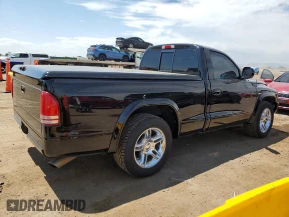1999 Dodge Dakota SLT with VIN 1B7GL26Z9XS278840, listed as a Copart auction lot 65640885 with 62,454 mi miles and Salvage title. Bid and sale history available at DreamBid. Image 3.