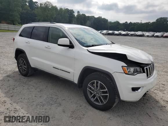 2020 Jeep Grand Cherokee Laredo E with VIN 1C4RJEAG7LC140868, listed as a Copart auction lot 69587565 with 76,879 mi miles and Salvage title. Bid and sale history available at DreamBid. Image 4.