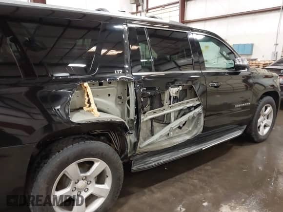 2016 Chevrolet Suburban LTZ with VIN 1GNSKJKCXGR108090, listed as a IAAI auction lot 42485236 with 120,395 mi miles and . Bid and sale history available at DreamBid. Image 17.