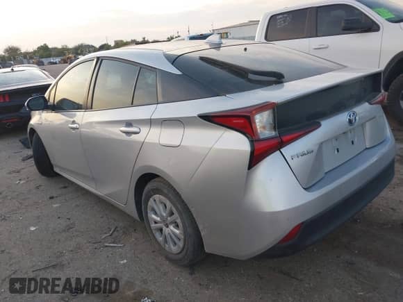 2021 Toyota Prius L Eco with VIN JTDKAMFUXM3143243, listed as a IAAI auction lot 43079577 with 87,002 mi miles and . Bid and sale history available at DreamBid. Image 3.