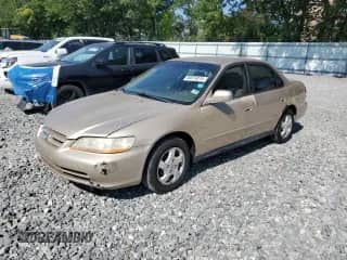 2001 Honda Accord LX with VIN 1HGCG66551A143151, listed as a Copart auction lot 66874015 with 148,448 mi miles and Clean title. Bid and sale history available at DreamBid. Image 1.