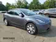 2022 Tesla Model Y Long Range with VIN 7SAYGAEEXNF361952, listed as a Copart auction lot 66031534 with Not provided miles and Salvage title. Bid and sale history available at DreamBid. Image 4.