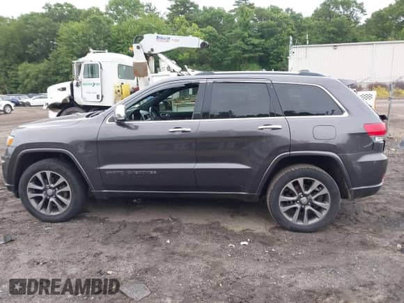 2017 Jeep Grand Cherokee Overland with VIN 1C4RJFCG0HC818791, listed as a IAAI auction lot 42574718 with 119,455 mi miles and . Bid and sale history available at DreamBid. Image 14.
