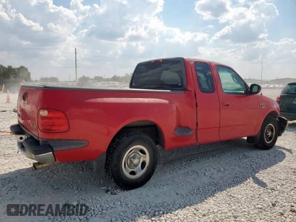 2000 Ford F-150 XL with VIN 1FTRX07WXYKB39193, listed as a Copart auction lot 85164785 with 296,921 mi miles and Salvage title. Bid and sale history available at DreamBid. Image 3.