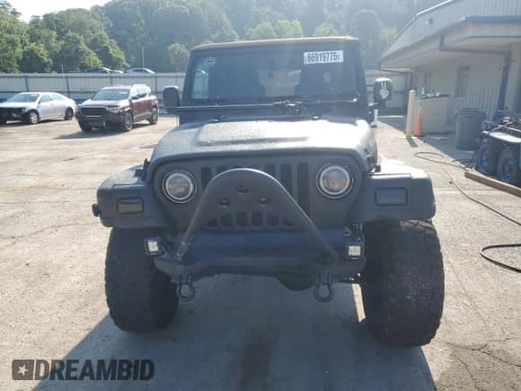 2003 Jeep Wrangler Rubicon с VIN 1J4FA69S23P310588, выставлен на аукционе Copart как лот 66919775 с пробегом 106 685 миль миль и Списание • Salvage title. История ставок и продаж доступна на DreamBid. Изображение 5.