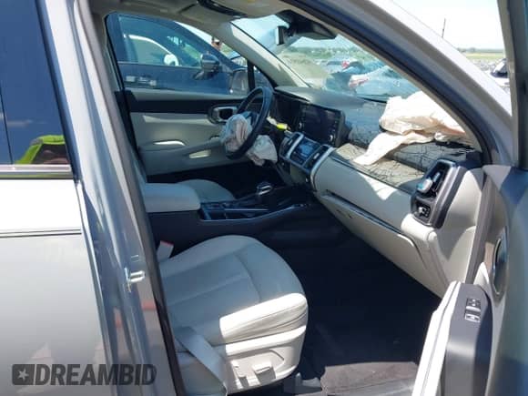 2023 Kia Sorento EX with VIN 5XYRH4LF5PG228054, listed as a IAAI auction lot 42641510 with 16,596 mi miles and . Bid and sale history available at DreamBid. Image 5.