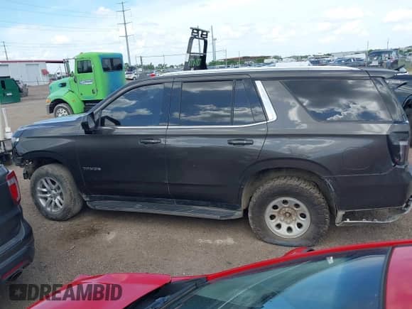 2021 Chevrolet Tahoe LT z VIN 1GNSCNKD6MR121413, wystawiony jako IAAI lot #42688065 z przebiegiem Nie podano mil oraz . Historia ofert i sprzedaży dostępna na DreamBid. Obrazek 15.