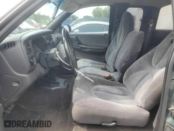 1999 Dodge Dakota SLT with VIN 1B7GL22X8XS283614, listed as a Copart auction lot 59412515 with 69,705 mi miles and Salvage title. Bid and sale history available at DreamBid. Image 7.