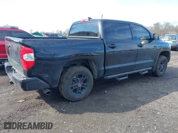2021 Toyota Tundra SR5 with VIN 5TFDY5F10MX964425, listed as a IAAI auction lot 41843735 with 108,005 mi miles and . Bid and sale history available at DreamBid. Image 4.