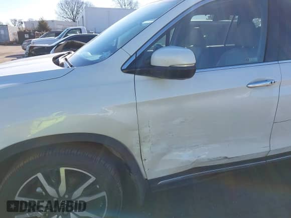 2021 Honda Pilot Touring 7-Passenger with VIN 5FNYF5H64MB031671, listed as a IAAI auction lot 41332415 with 90,411 mi miles and . Bid and sale history available at DreamBid. Image 6.