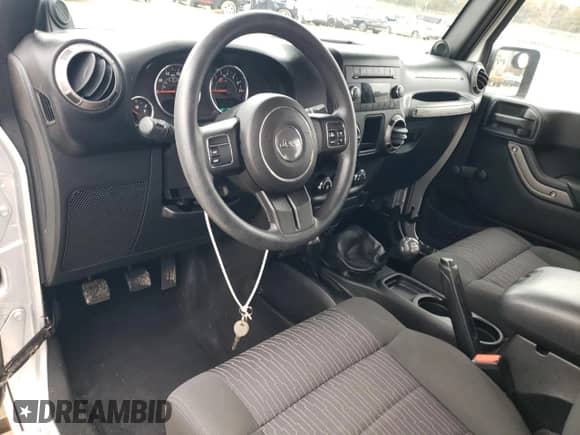2012 Jeep Wrangler Sport with VIN 1C4AJWAG2CL117209, listed as a Copart auction lot 90579055 with 48,119 mi miles and Clean title. Bid and sale history available at DreamBid. Image 8.