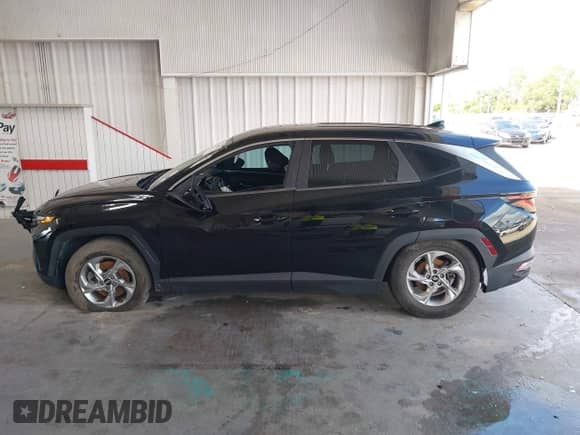 2022 Hyundai Tucson SE z VIN 5NMJA3AE1NH004787, wystawiony jako IAAI lot #43394874 z przebiegiem Nie podano mil oraz . Historia ofert i sprzedaży dostępna na DreamBid. Obrazek 14.