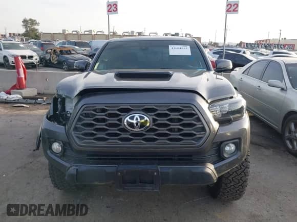 2021 Toyota Tacoma SR5 z VIN 3TMDZ5BN2MM108586, wystawiony jako IAAI lot #41604953 z przebiegiem 65 422 mil mil oraz . Historia ofert i sprzedaży dostępna na DreamBid. Obrazek 12.