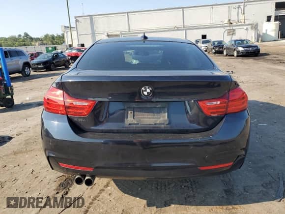 2015 BMW 4 Series 428i xDrive z VIN WBA4C9C59FD330304, wystawiony jako Copart lot #64786165 z przebiegiem 156 889 mil mil oraz Szkoda całkowita • Salvage title. Historia ofert i sprzedaży dostępna na DreamBid. Obrazek 6.