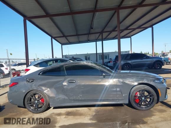 2022 BMW 4 Series M440i xDrive with VIN WBA13AR05NCJ90711, listed as a IAAI auction lot 42809557 with 17,854 mi miles and . Bid and sale history available at DreamBid. Image 13.