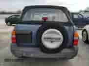 1999 Chevrolet Tracker z VIN 2CNBE18C4X6906275, wystawiony jako Copart lot #84539424 z przebiegiem 53 235 mil mil oraz Szkoda całkowita • Salvage title. Historia ofert i sprzedaży dostępna na DreamBid. Obrazek 6.