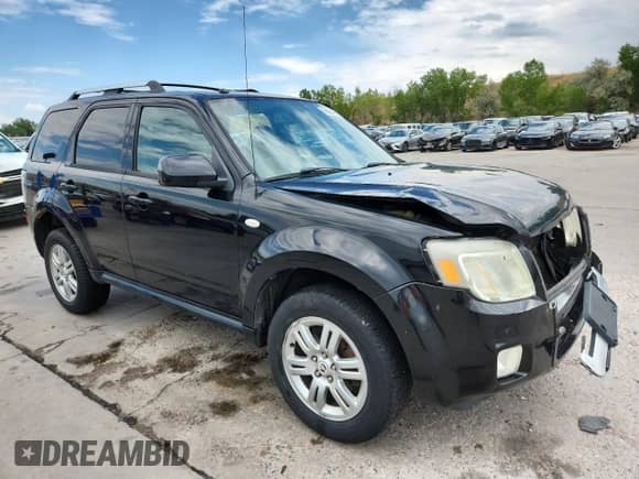 2008 Mercury Mariner Premier with VIN 4M2CU97108KJ12909, listed as a Copart auction lot 70864465 with 128,018 mi miles and Salvage title. Bid and sale history available at DreamBid. Image 4.