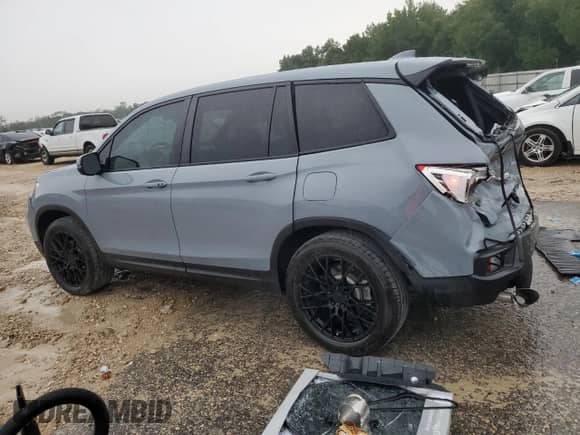 2023 Honda Passport EX-L with VIN 5FNYF8H57PB010844, listed as a Copart auction lot 65769665 with 41,842 mi miles and Salvage title. Bid and sale history available at DreamBid. Image 2.