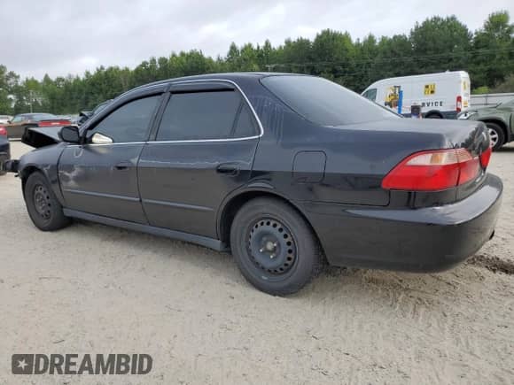 2000 Honda Accord LX z VIN 1HGCG6555YA130086, wystawiony jako Copart lot #68388535 z przebiegiem 221 560 mil mil oraz Szkoda całkowita • Salvage title. Historia ofert i sprzedaży dostępna na DreamBid. Obrazek 2.