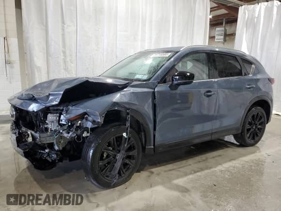 2023 Mazda CX-5 S Carbon Edition z VIN JM3KFBCM0P0292011, wystawiony jako Copart lot #71715585 z przebiegiem 30 893 mil mil oraz Szkoda całkowita • Salvage title. Historia ofert i sprzedaży dostępna na DreamBid. Obrazek 1.