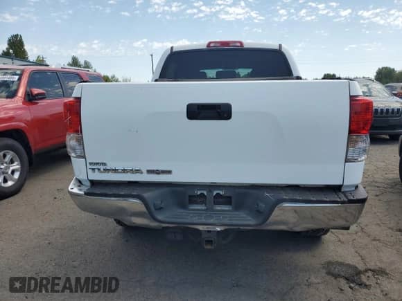 2011 Toyota Tundra with VIN 5TFEY5F1XBX111676, listed as a Copart auction lot 55534395 with 218,008 mi miles and Salvage title. Bid and sale history available at DreamBid. Image 6.