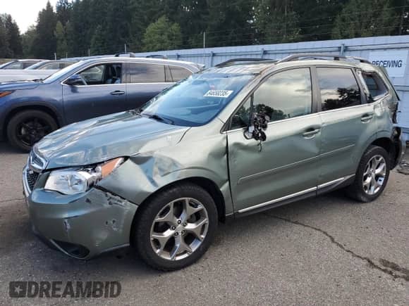 2015 Subaru Forester Touring with VIN JF2SJAWC5FH594724, listed as a Copart auction lot 84658235 with 72,361 mi miles and Salvage title. Bid and sale history available at DreamBid. Image 1.