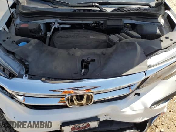 2020 Honda Pilot Touring 8-Passenger z VIN 5FNYF5H94LB011994, wystawiony jako Copart lot #56168045 z przebiegiem 91 737 mil mil oraz Szkoda całkowita • Salvage title. Historia ofert i sprzedaży dostępna na DreamBid. Obrazek 12.