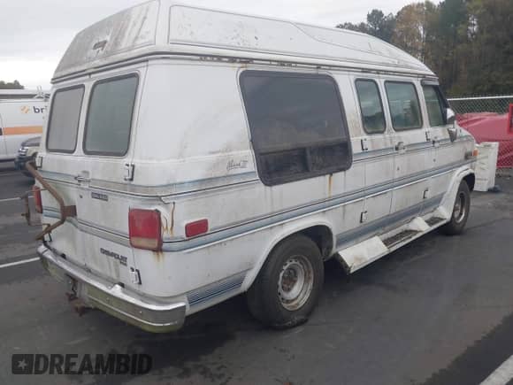 1994 Chevrolet Chevy Van z VIN 1GBEG25K6RF160003, wystawiony jako IAAI lot #43523927 z przebiegiem 145 147 mil mil oraz . Historia ofert i sprzedaży dostępna na DreamBid. Obrazek 4.