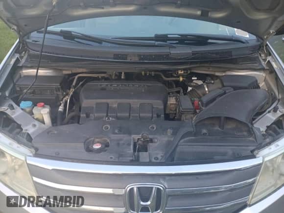 2013 Honda Odyssey EX-L z VIN 5FNRL5H69DB022042, wystawiony jako Copart lot #86334825 z przebiegiem 181 964 mil mil oraz Czysty tytuł • Clean title. Historia ofert i sprzedaży dostępna na DreamBid. Obrazek 7.