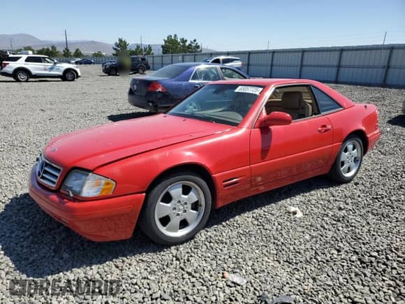 2000 Mercedes-Benz SL 500 with VIN WDBFA68F9YF190276, listed as a Copart auction lot 63057725 with Not provided miles and Salvage title. Bid and sale history available at DreamBid. Image 1.