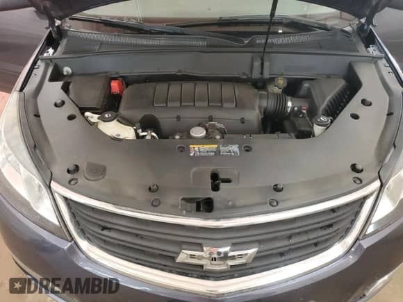 2014 Chevrolet Traverse LS z VIN 1GNKVFED1EJ201763, wystawiony jako Copart lot #69840465 z przebiegiem 148 451 mil mil oraz Szkoda całkowita • Salvage title. Historia ofert i sprzedaży dostępna na DreamBid. Obrazek 12.