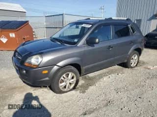 2009 Hyundai Tucson GLS with VIN KM8JM12B09U009571, listed as a Copart auction lot 84885555 with 156,939 mi miles and Salvage title. Bid and sale history available at DreamBid. Image 1.