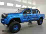 2005 Toyota Tacoma PreRunner with VIN 3TMJU62N05M002100, listed as a Copart auction lot 84837805 with 300,227 mi miles and Clean title. Bid and sale history available at DreamBid. Image 1.