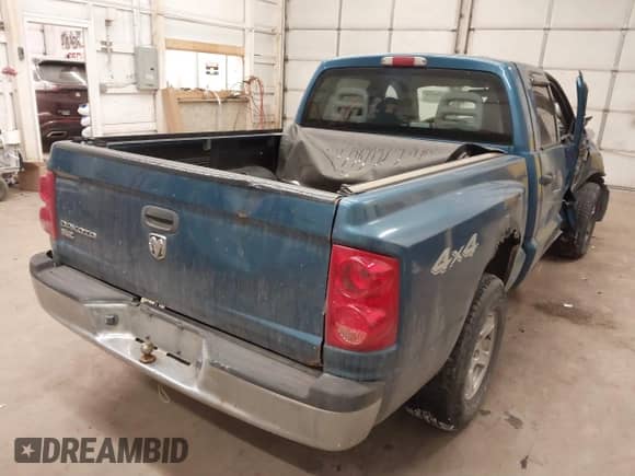 2005 Dodge Dakota SLT with VIN 1D7HW48KX5S306252, listed as a IAAI auction lot 41399238 with 140,474 mi miles and . Bid and sale history available at DreamBid. Image 4.