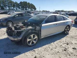 2018 Honda Accord Touring с VIN 1HGCV2F91JA006919, выставлен на аукционе Copart как лот 82345515 с пробегом 128 886 миль миль и Списание • Salvage title. История ставок и продаж доступна на DreamBid. Изображение 1.