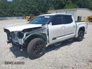 2025 Toyota Tundra SR5 with VIN 5TFWA5DB6SX250272, listed as a Copart auction lot 63450315 with 14,828 mi miles and Salvage title. Bid and sale history available at DreamBid. Image 1.