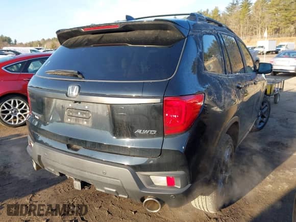 2022 Honda Passport EX-L with VIN 5FNYF8H5XNB020829, listed as a IAAI auction lot 41757349 with 20,456 mi miles and . Bid and sale history available at DreamBid. Image 4.