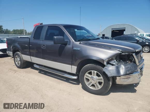 2007 Ford F-150 XL with VIN 1FTPX12V67KB02975, listed as a Copart auction lot 80307185 with 129,442 mi miles and Salvage title. Bid and sale history available at DreamBid. Image 4.