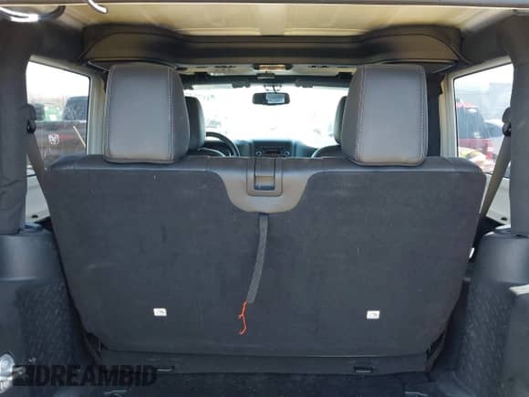 2018 Jeep Wrangler Sahara with VIN 1C4AJWBG9JL860882, listed as a IAAI auction lot 41752798 with 88,169 mi miles and . Bid and sale history available at DreamBid. Image 18.