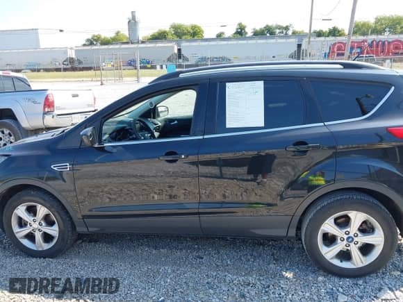2014 Ford Escape SE with VIN 1FMCU0G91EUA34787, listed as a IAAI auction lot 43215686 with 168,628 mi miles and . Bid and sale history available at DreamBid. Image 15.