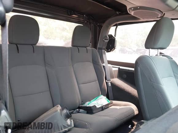 2019 Jeep Wrangler Sport S with VIN 1C4GJXAG0KW552128, listed as a IAAI auction lot 42400023 with 58,131 mi miles and . Bid and sale history available at DreamBid. Image 8.