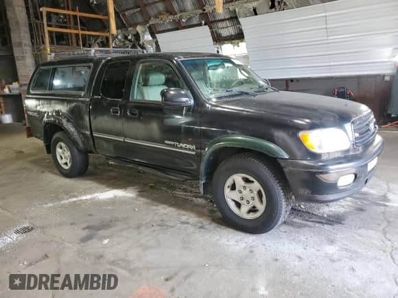 2001 Toyota Tundra Limited z VIN 5TBBT48141S154805, wystawiony jako Copart lot #66225125 z przebiegiem 216 119 mil mil oraz Czysty tytuł • Clean title. Historia ofert i sprzedaży dostępna na DreamBid. Obrazek 4.