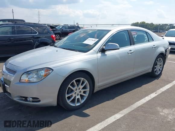 2012 Chevrolet Malibu LTZ z VIN 1G1ZG5E77CF182005, wystawiony jako IAAI lot #43173658 z przebiegiem 188 124 mil mil oraz . Historia ofert i sprzedaży dostępna na DreamBid. Obrazek 2.