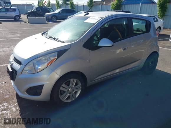 2014 Chevrolet Spark LS with VIN KL8CB6S95EC453597, listed as a IAAI auction lot 42454469 with 104,181 mi miles and . Bid and sale history available at DreamBid. Image 2.