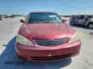 2002 Toyota Camry LE z VIN 4T1BE30K82U082841, wystawiony jako Copart lot #80754015 z przebiegiem 192 738 mil mil oraz Szkoda całkowita • Salvage title. Historia ofert i sprzedaży dostępna na DreamBid. Obrazek 5.
