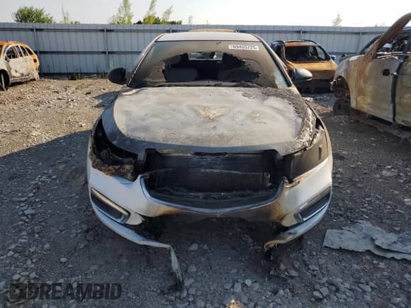 2015 Chevrolet Cruze LS с VIN 1G1PA5SH5F7171587, выставлен на аукционе Copart как лот 69455725 с пробегом Не указан миль и Списание • Salvage title. История ставок и продаж доступна на DreamBid. Изображение 5.