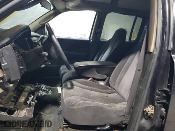 2002 Dodge Dakota SLT z VIN 1B7HG48Z32S670125, wystawiony jako Copart lot #51124525 z przebiegiem Nie podano mil oraz Szkoda całkowita • Salvage title. Historia ofert i sprzedaży dostępna na DreamBid. Obrazek 7.