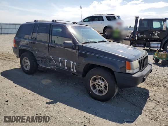 1998 Jeep Grand Cherokee Limited z VIN 1J4GZ78Y5WC185820, wystawiony jako Copart lot #67221725 z przebiegiem 280 414 mil mil oraz Szkoda całkowita • Salvage title. Historia ofert i sprzedaży dostępna na DreamBid. Obrazek 4.